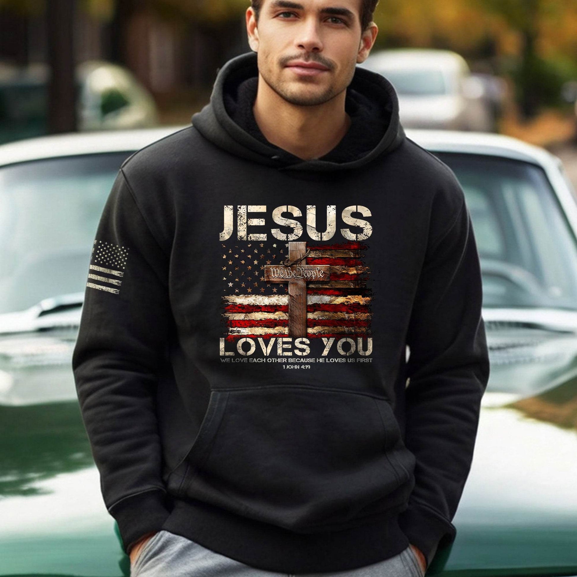 Jesus Loves You Hoodie – 1 John 4:19 Cross & We The People Flag - Rust Field Wear