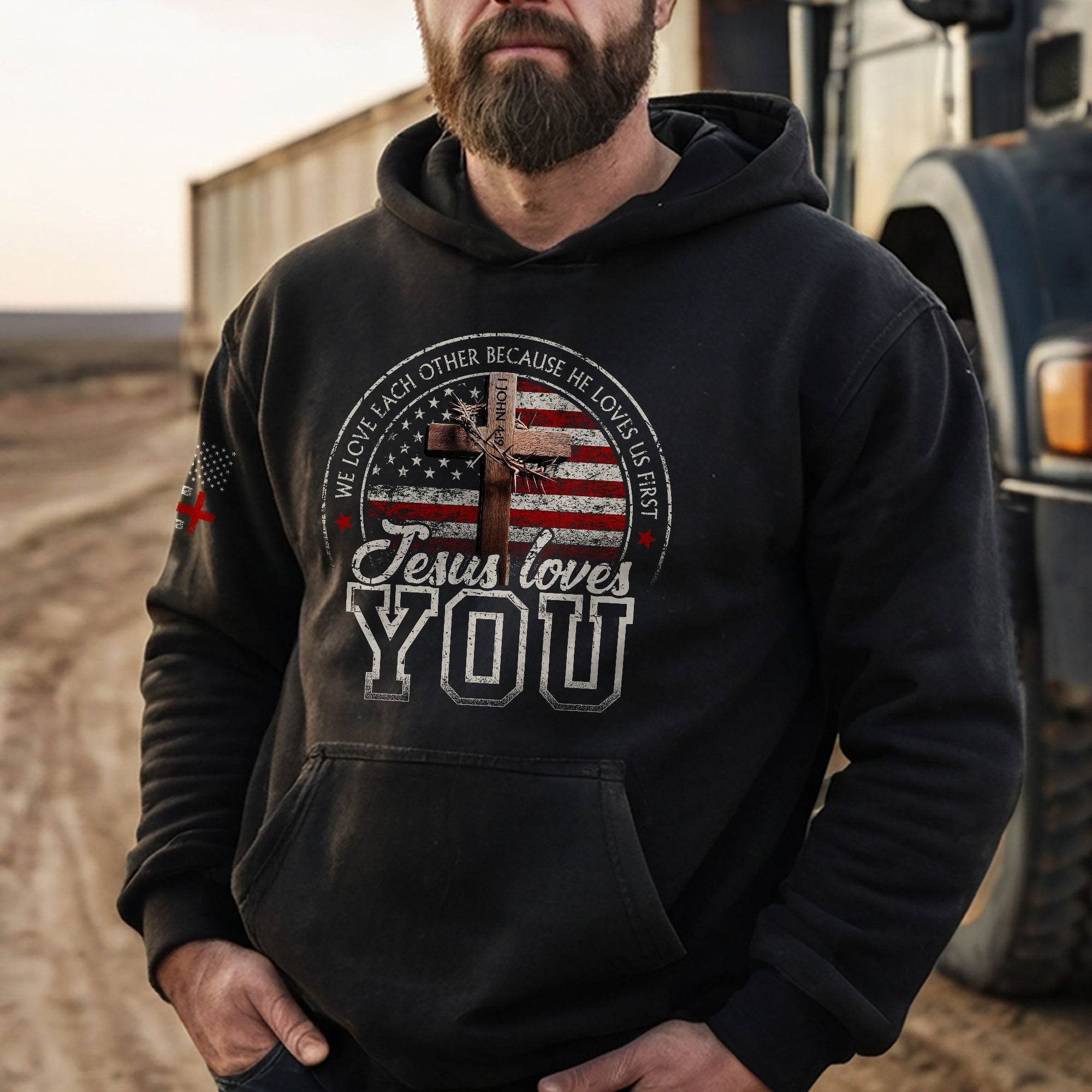 Jesus Loves You Hoodie – 1 John 4:19 Cross & Flag Graphic - Rust Field Wear