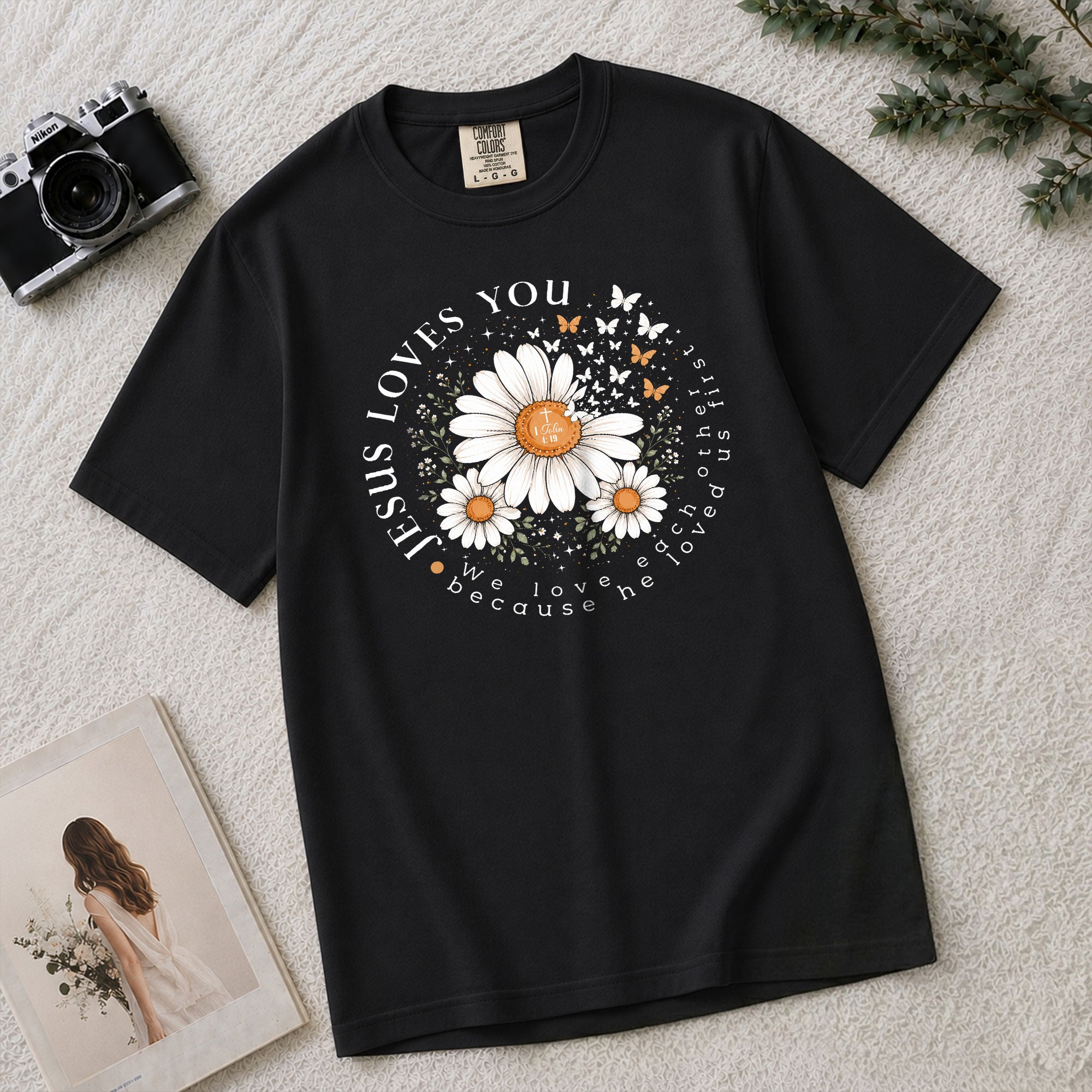 Jesus Loves You Daisy Butterfly 1 John 4:19 Christian Graphic Tee For Women Apparel
