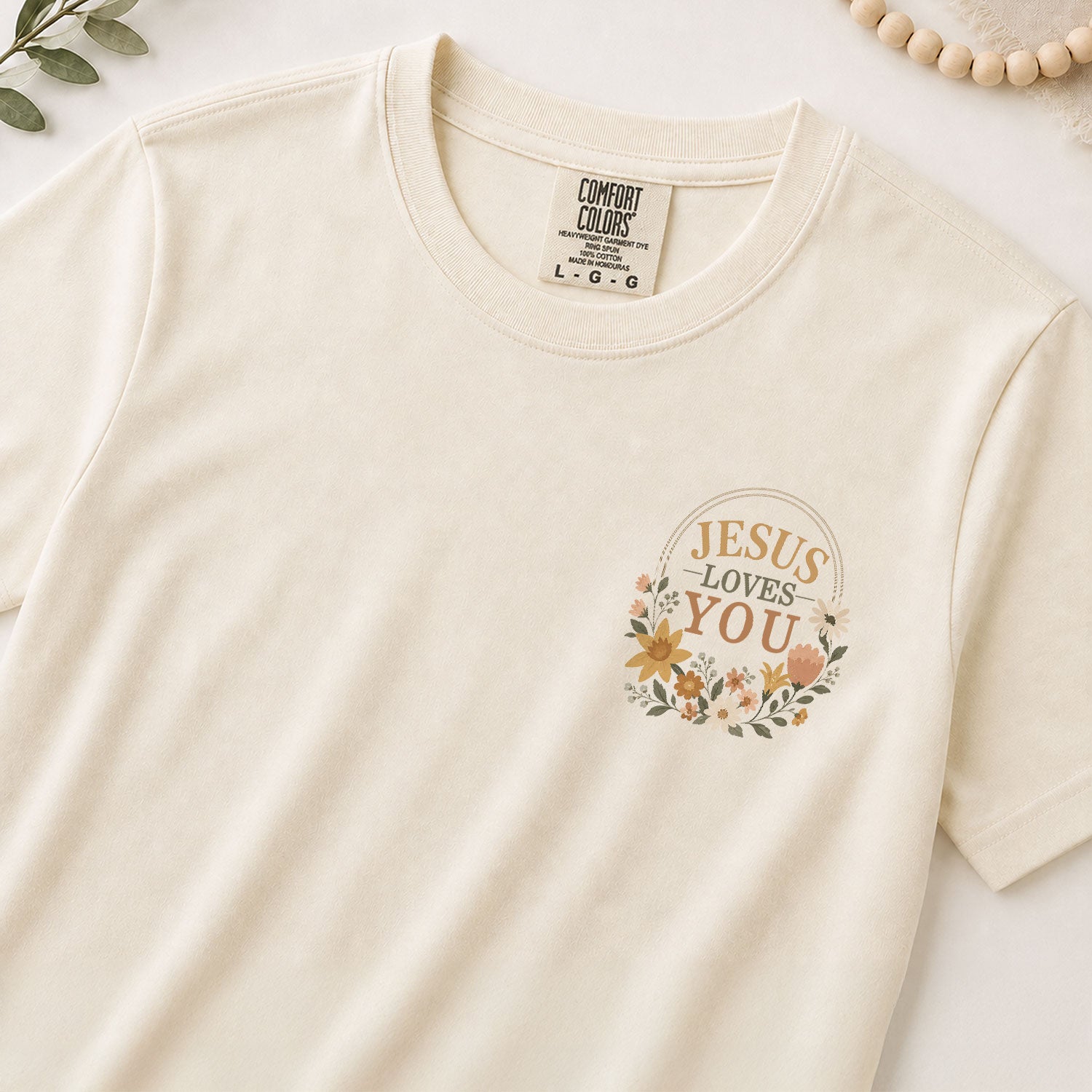 Jesus Loves You Pink Floral Cross 1 John 4:19 Christian Graphic Tee For Women Apparel