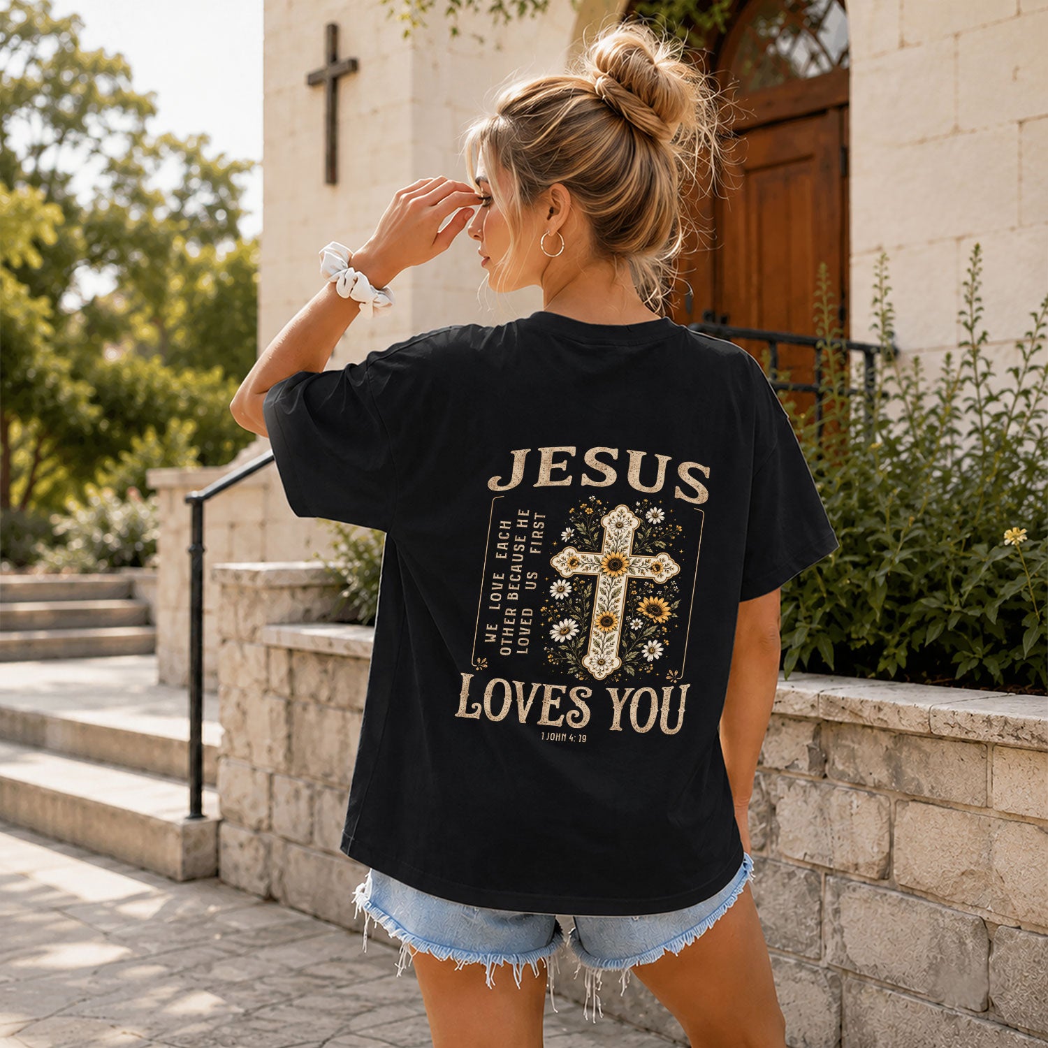 Jesus Loves You Floral Cross 1 John 4:19 Christian Graphic Tee For Women Apparel
