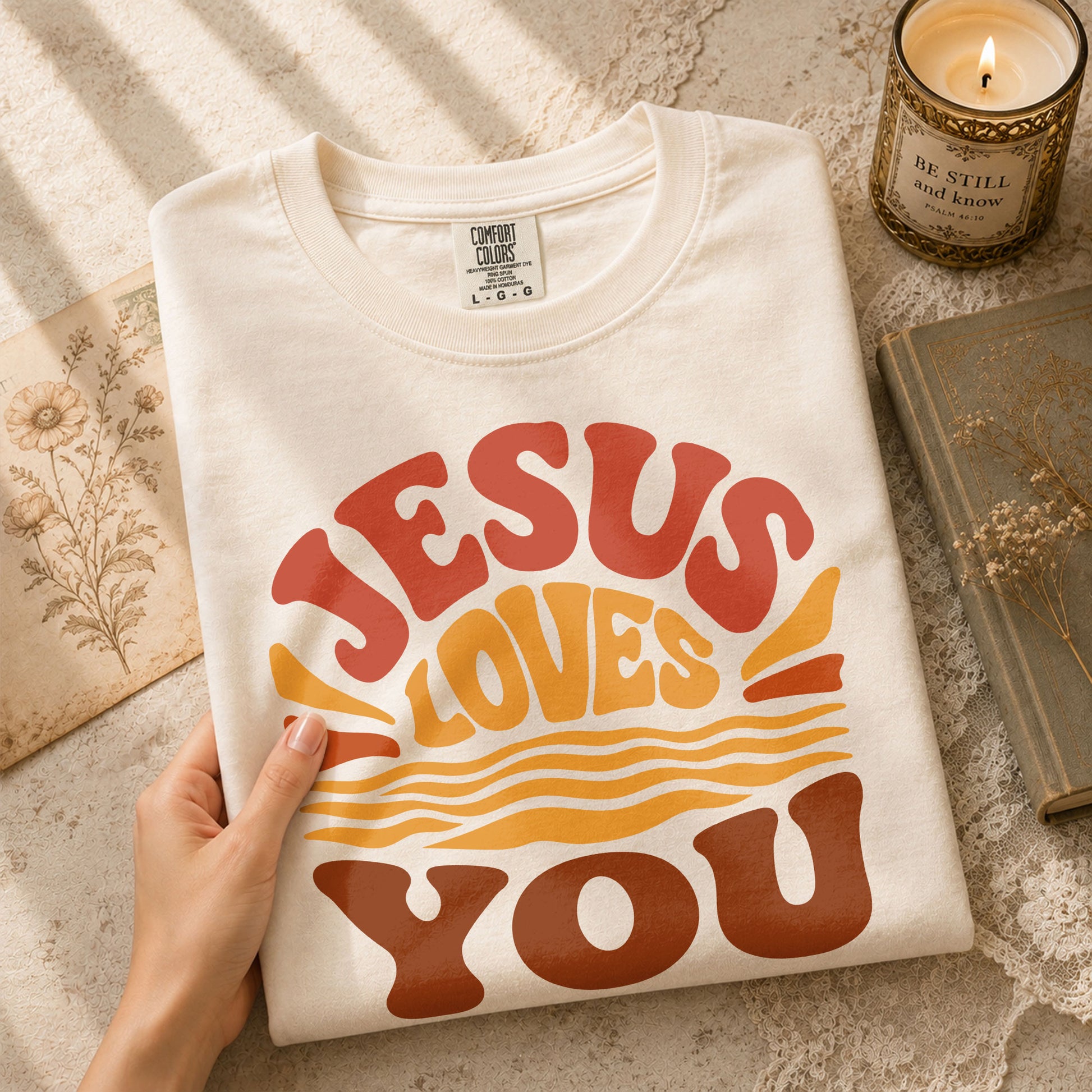 Jesus Loves You Shirt Sunset Wavy 70s Christian Bible Verse 1 John 4 19 Graphic Tee - Rust Field Wear