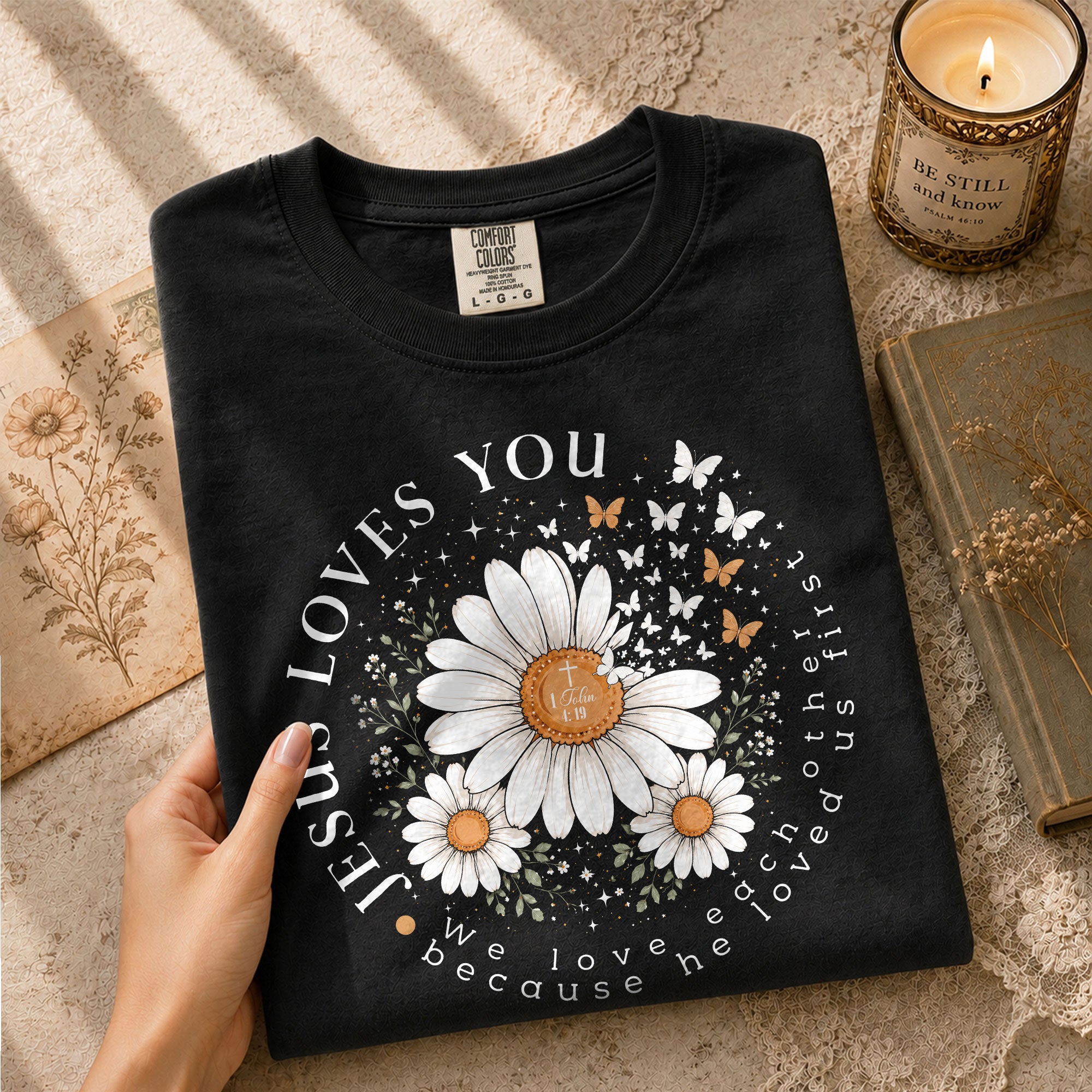 Jesus Loves You Daisy Butterfly 1 John 4:19 Christian Graphic Tee For Women Apparel