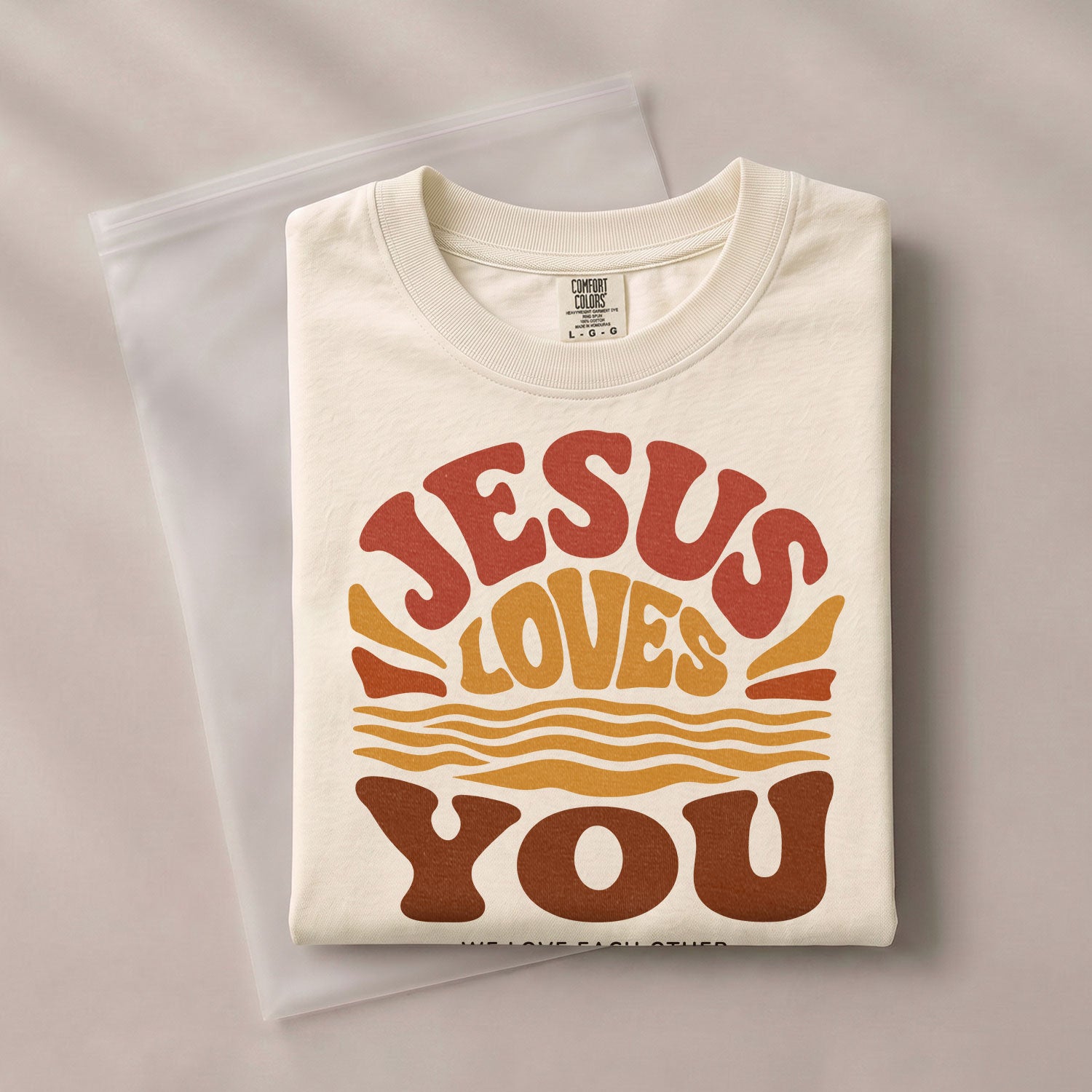 Jesus Loves You Shirt Sunset Wavy 70s Christian Bible Verse 1 John 4 19 Graphic Tee - Rust Field Wear