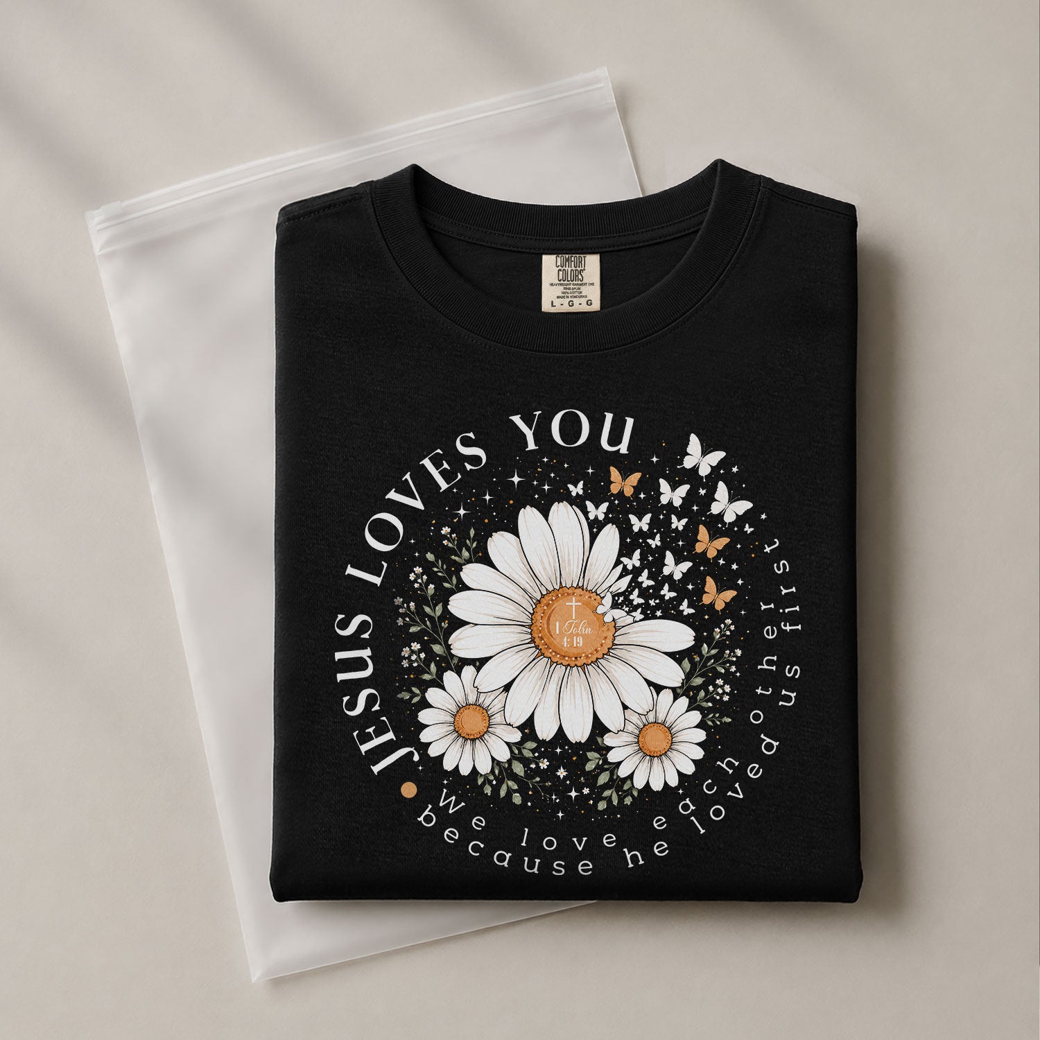 Jesus Loves You Daisy Butterfly 1 John 4:19 Christian Graphic Tee For Women Apparel