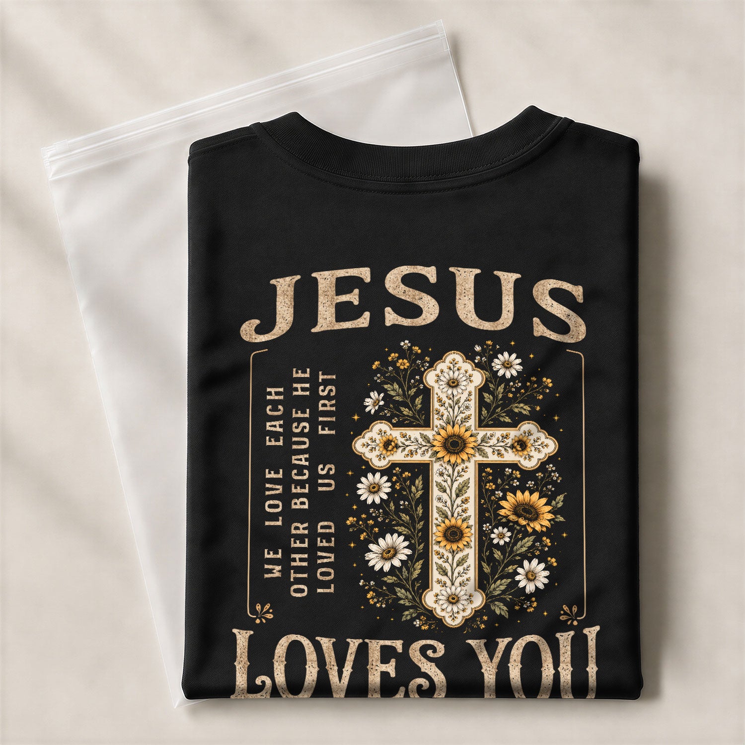 Jesus Loves You Floral Cross 1 John 4:19 Christian Graphic Tee For Women Apparel