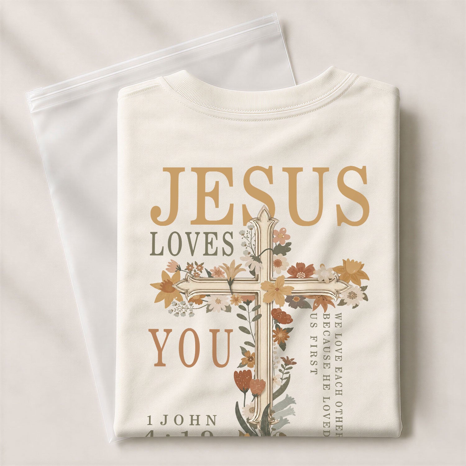 Jesus Loves You Pink Floral Cross 1 John 4:19 Christian Graphic Tee For Women Apparel