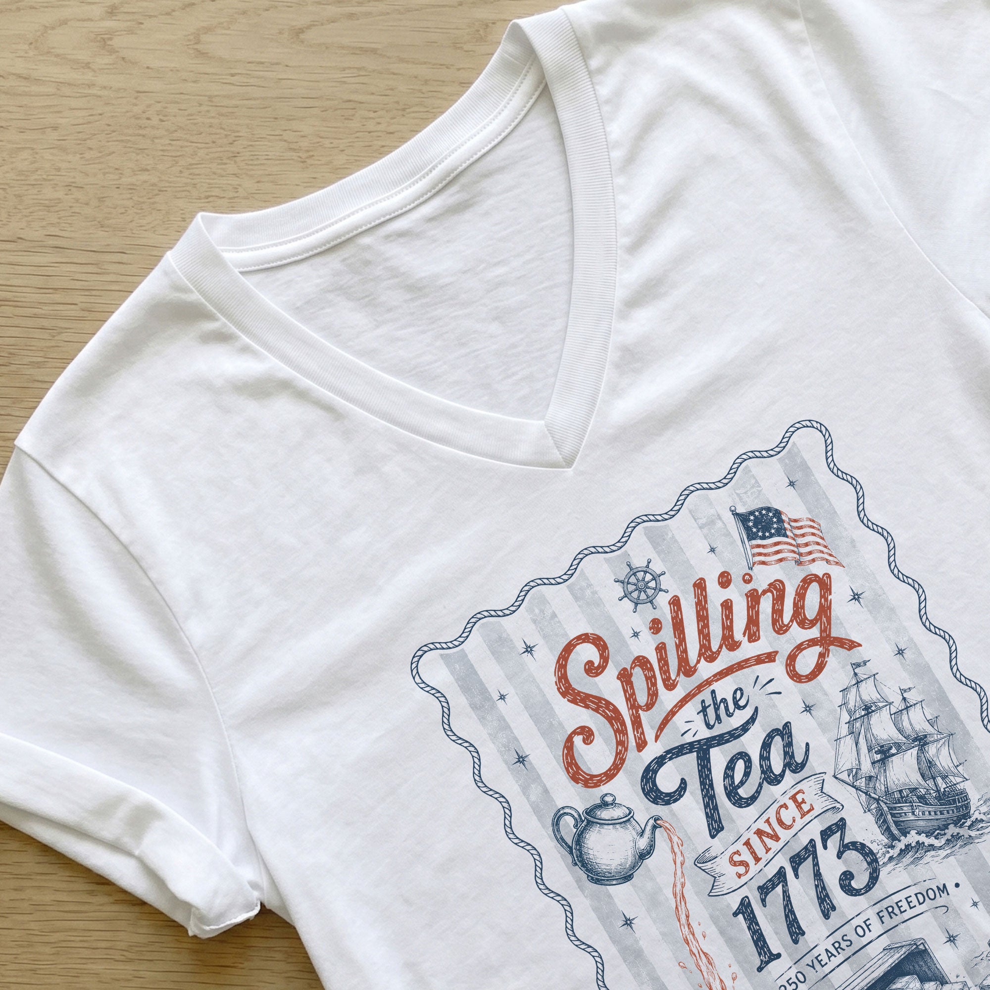 Women Spilling The Tea Since 1773 V-Neck Shirt Patriotic Vintage Freedom Graphic Tee