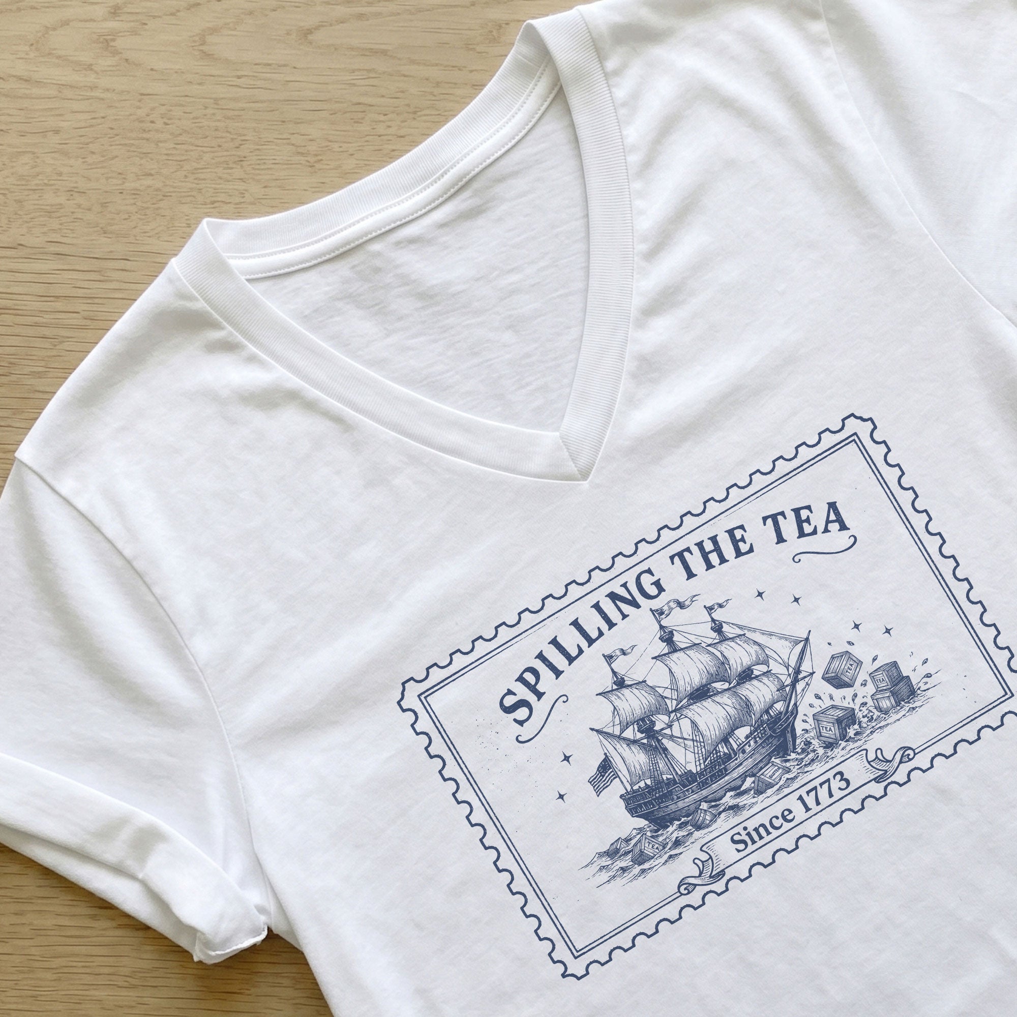 Women Spilling The Tea Since 1773 V-Neck Shirt Vintage Patriotic Ship Graphic Tee