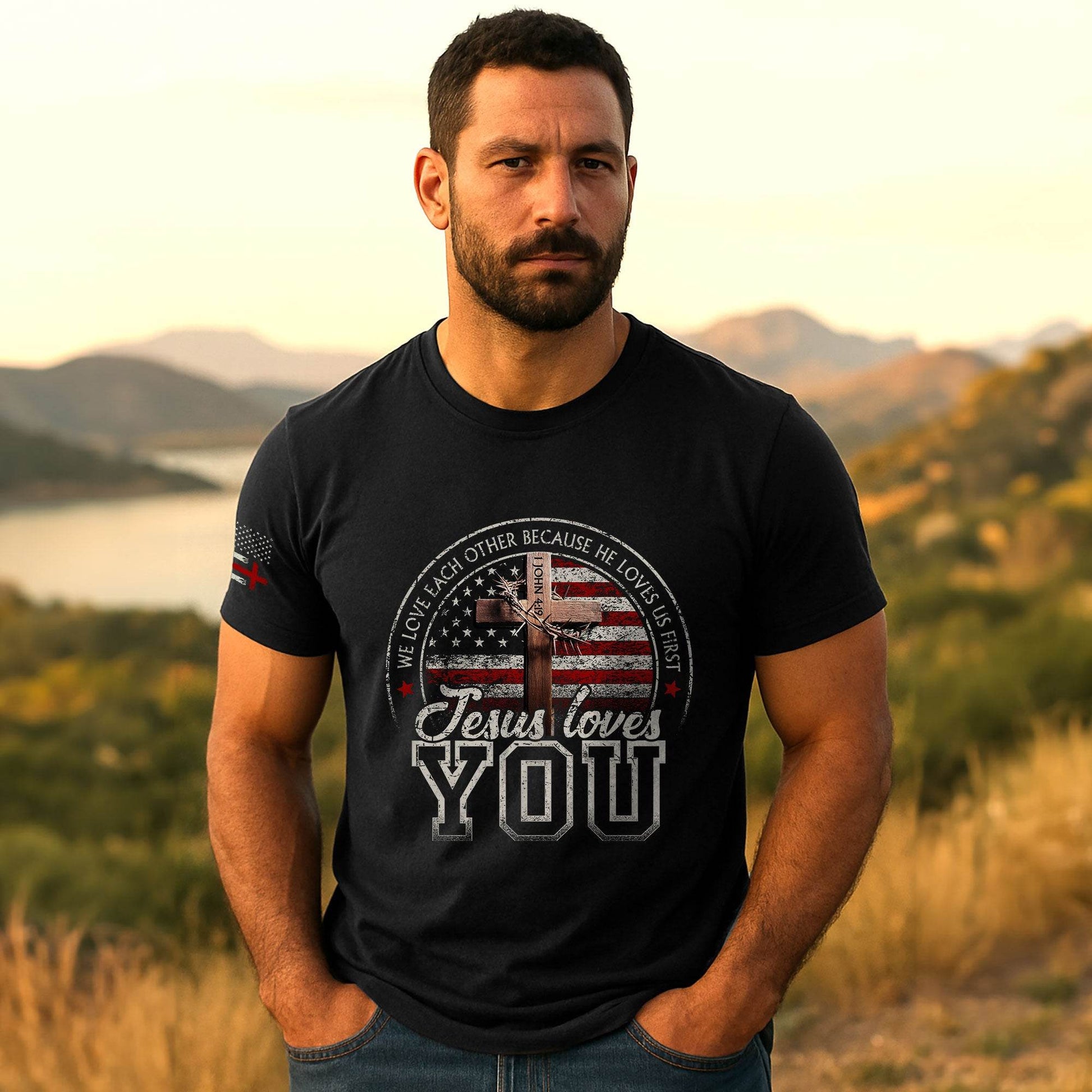 Jesus Loves You T-Shirt – American Flag Cross & 1 John 4:19 Verse - Rust Field Wear