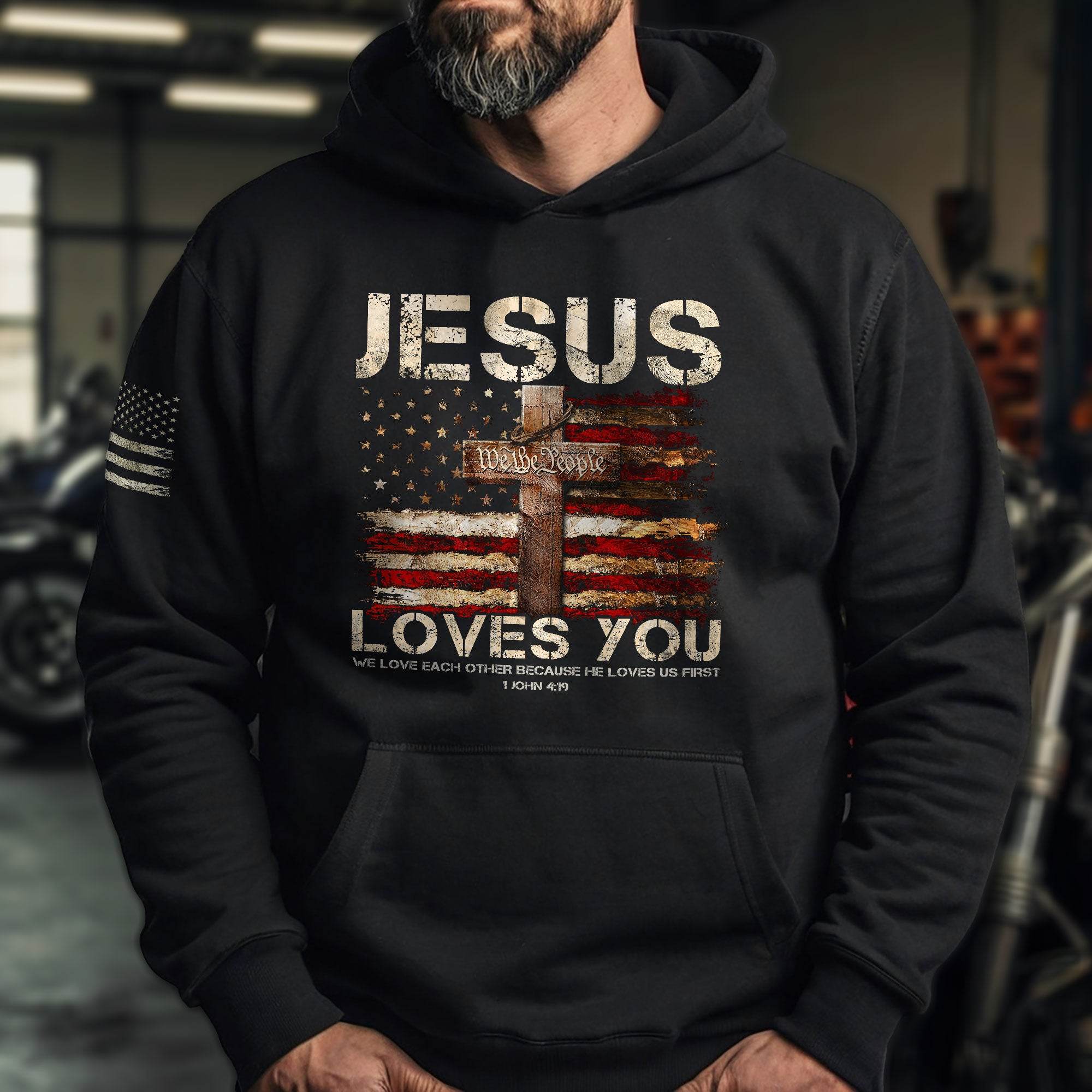 Jesus Loves You Hoodie – 1 John 4:19 Cross & We The People Flag - Rust Field Wear